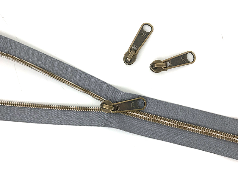 Reissverschluss endlos, metallisiert Altmessing, Hellgrau